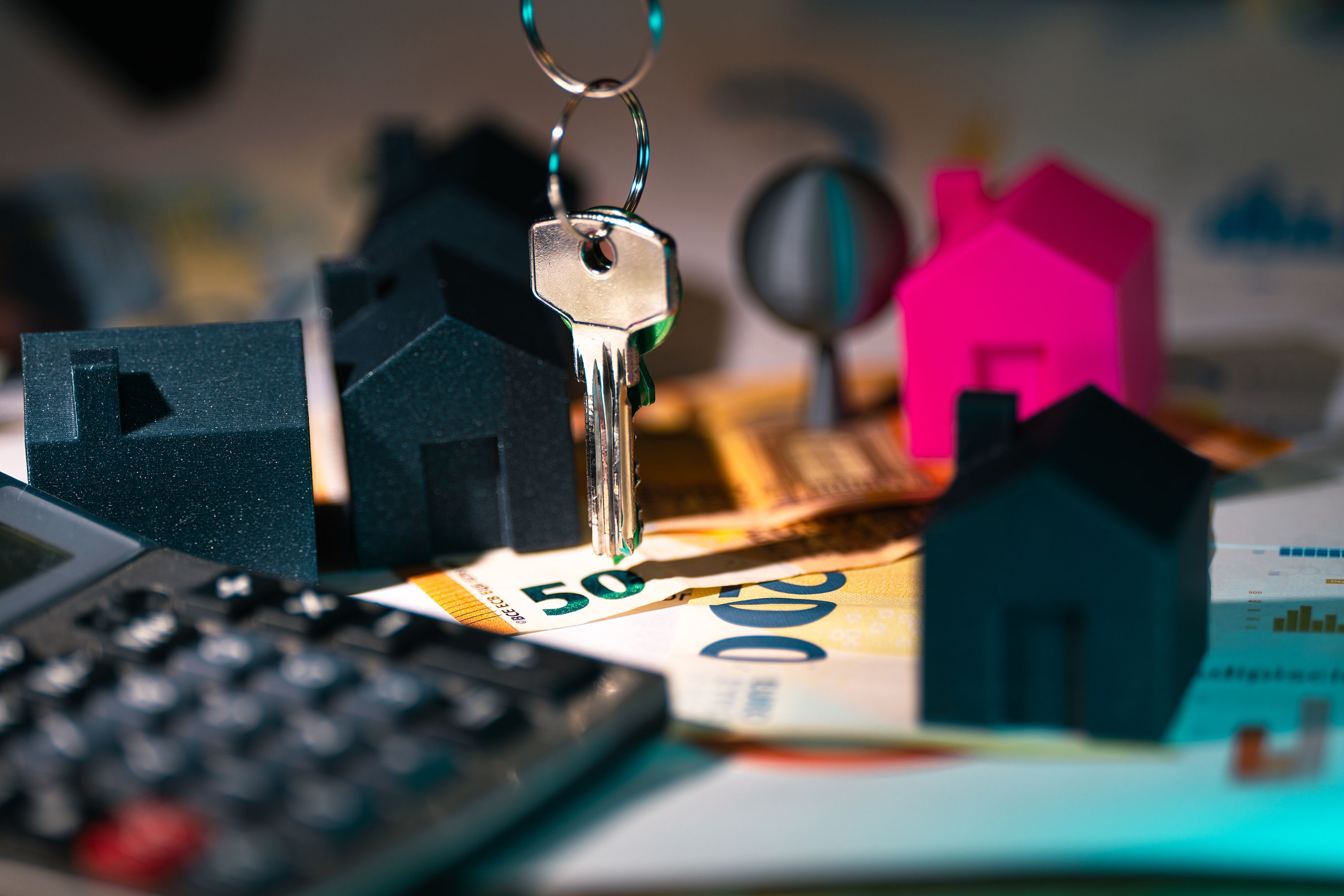 House models, keys, and euro banknotes as a symbol of real estate financing